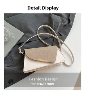 Detail van crème leer en kaki geweven textuur met gouden sluiting op de crossbodytas