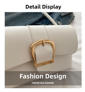 Close-up of premium white leather bag with gold D-shaped buckle and fine stitching