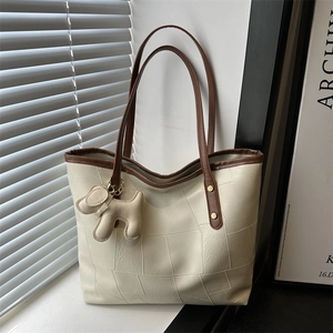 Large cream PU leather tote bag with contrast stitching and cute puppy pendant accessory