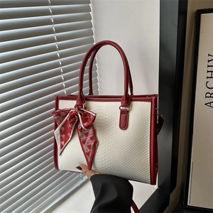 Chic cream snakeskin tote bag with red trim and heart print scarf accent for women