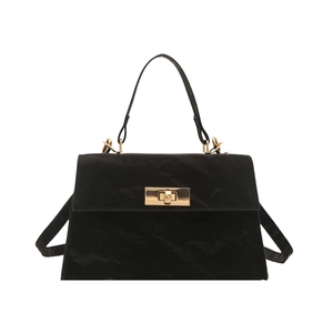 Minimalist black crossbody trapezoid bag with gold hardware and top handle for women