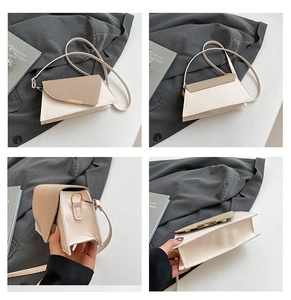 Detailweergaven van een crèmekleurige trapezium schoudertas met champagne glitterflap