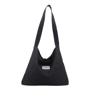 Bohemian reversible denim tote bag with ethnic patchwork and central fabric label detail
