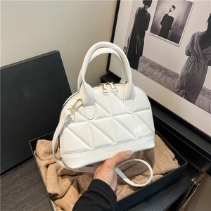 White quilted shell handbag with gold hardware and dual top handles for women