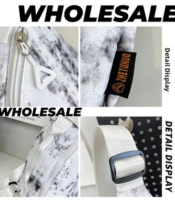 Detailed macro view of nylon crossbody bag featuring metallic zippers and branded woven label