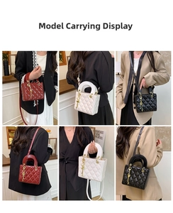 Quilted crossbody bag with top handles and metallic charms in red, black, and white