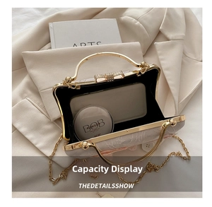 Detail view of embroidered evening bag showing interior capacity for phone and cosmetics