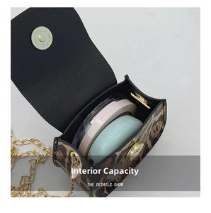 Internal view of mini leopard print bag showing capacity for two makeup compacts