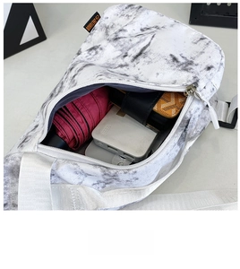 Top view of spacious main compartment in nylon sling bag showing daily essentials