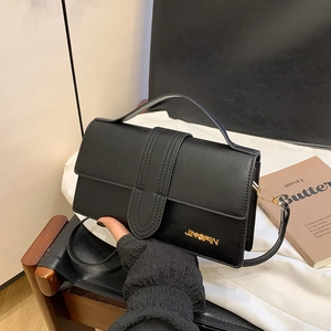 Fashionable black faux leather crossbody bag with gold JINGPIN logo and top handle