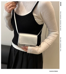 Silver mini crossbody bag for girls featuring a metallic finish and a slender chain strap