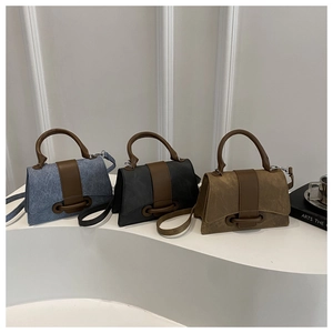 Detailed comparison of crossbody bags in blue, grey, and olive with textured finish