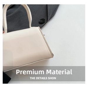 Détail macro de la texture du cuir blanc et des coutures soignées sur le côté du sac