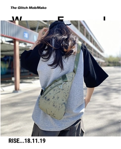 Outdoor shot of green abstract pattern nylon chest bag with adjustable strap for men