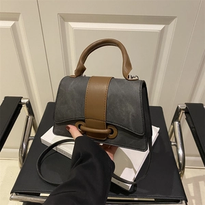 Mini vintage top handle crossbody bag in textured dark grey and brown contrast finish