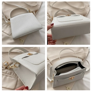 Détails du sac à main blanc grainé avec fermoir doré et vue sur la capacité intérieure
