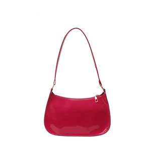 Glossy magenta patent leather large hobo shoulder bag with a sleek minimalist design