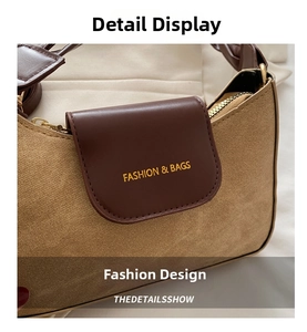 Détail du sac bandoulière rétro en toile avec rabat en cuir et fermeture éclair dorée