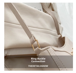 Detailed close-up of beige PU leather shoulder bag featuring gold rectangular hardware