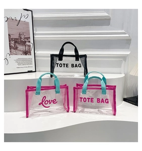 Detailed close-up of transparent tote bags with mesh panels and contrast color handles