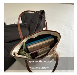 Spacious interior of white patchwork tote showing storage for tablets and books