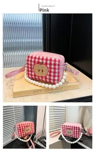 Detailed views of a pink plaid mini bag with embroidery and white pearl handle
