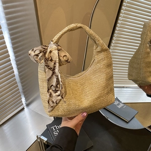 Beige woven straw hobo handbag with elegant chain-pattern silk scarf handle detail