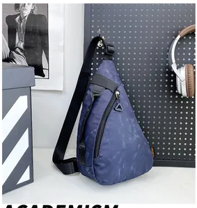 Detail of waterproof nylon chest bag with blue marble pattern and adjustable strap