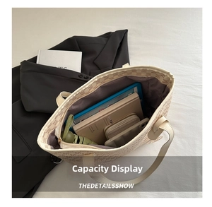 Large capacity tote bag showing interior space with tablet, umbrella and wallet