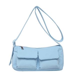 Light blue utility nylon crossbody bag with dual pockets and adjustable shoulder strap