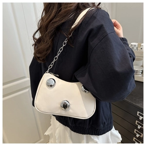White crescent underarm bag with three polished silver spheres and chain strap detail