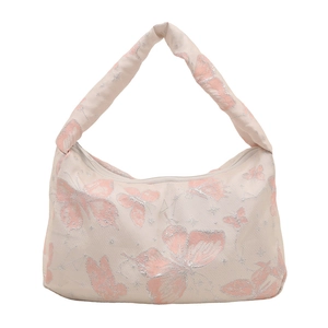 Fashionable butterfly jacquard shoulder bag with glitter details on a cream background