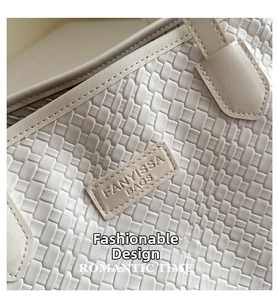 Detail of white woven checkered texture and leather brand patch on tote bag