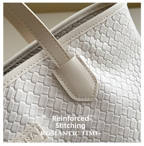Macro view of woven PU leather texture and reinforced stitching on a white tote bag