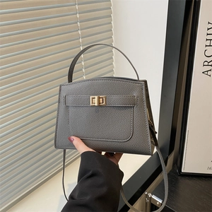 Dark grey lychee grain leather handbag with gold twist lock and top handle for women