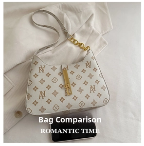 Detailed comparison of the printed baguette bag size next to a modern smartphone