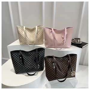 Detail view of large tote bags in four colors with signature M pattern and metal charms