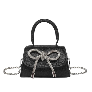 Sac à main noir pailleté élégant avec grand nœud en strass et chaîne en argent
