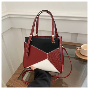 Chic tricolor patchwork crossbody bag with woven texture and gold hardware details