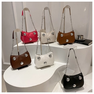 Selection of vibrant studded PU leather shoulder bags in various stylish colors