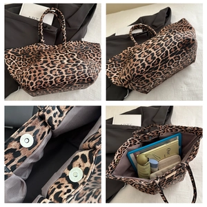 Detail view of large leopard print tote bag with magnetic snaps and spacious interior