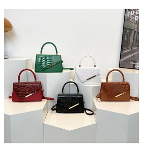 Group of luxury crocodile pattern handbags in five colors on geometric pedestals