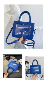 Close-up of royal blue ita bag with transparent window for doll display and PU leather