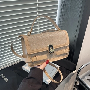 Elegant beige sequined handbag with gold twist lock and adjustable strap for women