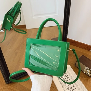 Sac à main vert tendance avec fenêtre transparente, poignée et bandoulière chic