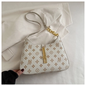 Detailed view of beige hobo bag with vintage brown monogram print and golden chain strap