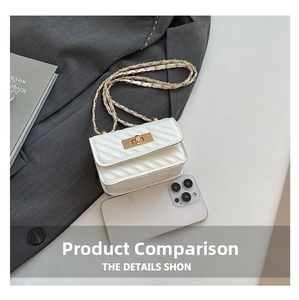 Detailed view of white quilted mini bag with V-pattern, gold lock and metal chain strap