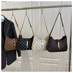 Detail of four retro printed hobo bags in brown, black, cream, and coffee colors