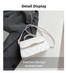 Detail view of white quilted faux leather bag with elegant rectangular metal magnetic clasp