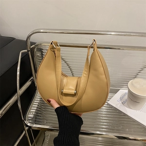 Fashionable khaki crescent shoulder bag with wide handle and metallic buckle detail